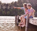 Happy family, lake and nature for travel, holiday and vacation in cape town, countryside and dock. Father, mom and