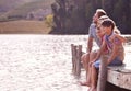 Happy family, lake and nature for vacation, holiday and travel in cape town, countryside and dock. Father, mom and