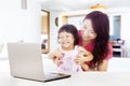 Happy family with laptop at home Royalty Free Stock Photo