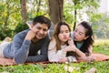 A happy family laying down on the yard