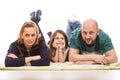 Happy family laying on floor Royalty Free Stock Photo