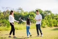 Happy family life concept. Asian parents Father, Mother and the little girl enjoying and fun during playing soap bubbles. family Royalty Free Stock Photo