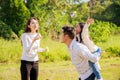 Happy family life concept. Asian parents Father, Mother and the little girl enjoying and fun during playing soap bubbles. family Royalty Free Stock Photo