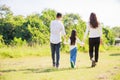 Happy family life concept. Asian parents Father, Mother and the little girl walking and have fun and enjoyed ourselves together Royalty Free Stock Photo