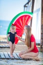 Happy family lifestyle. Relaxing and enjoying life. Bright colors. Top view Young mother with cute daughter Summer travel, water Royalty Free Stock Photo