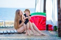 Happy family lifestyle. Relaxing and enjoying life. Bright colors. Top view Young mother with cute daughter Summer travel, water Royalty Free Stock Photo