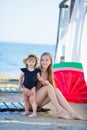 Happy family lifestyle. Relaxing and enjoying life. Bright colors. Top view Young mother with cute daughter Summer travel, water Royalty Free Stock Photo