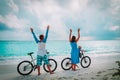 Happy family with little baby biking on beach Royalty Free Stock Photo