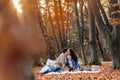 Happy family with little cute child in park on yellow leaf with Royalty Free Stock Photo