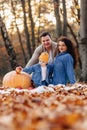Happy family with little cute child in park on yellow leaf with Royalty Free Stock Photo