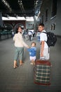 Happy family with little girl at railway station Royalty Free Stock Photo