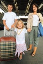 Happy family with little girl at railway station Royalty Free Stock Photo