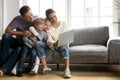 Happy family with little kids enjoying using laptop computer tog Royalty Free Stock Photo