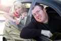 Happy family look out from car windows Royalty Free Stock Photo