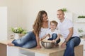 Happy family looking at the camera in kitchen Royalty Free Stock Photo