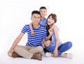 Happy  family looking at camera and  sitting on white background Royalty Free Stock Photo