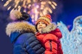 Happy family looking fireworks in the evening sky. fireworks new year, christmas. Crazy 2020 is over, it`s 2021 Royalty Free Stock Photo