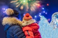 Happy family looking fireworks in the evening sky. fireworks new year, christmas. Crazy 2020 is over, it`s 2021 Royalty Free Stock Photo