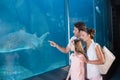 Happy family looking at fish tank Royalty Free Stock Photo