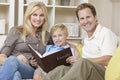 Happy Family Looking at Photo Album Royalty Free Stock Photo