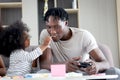 Happy family love bonding, African father and daughter girl with curly hair enjoy spending time together at home, little child kid Royalty Free Stock Photo