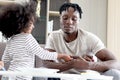 Happy family love bonding, African father and daughter girl with curly hair enjoy spending time together at home, little child kid Royalty Free Stock Photo