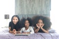 Happy family love bonding, enjoy spending time together at home, Portrait of African Asin mixed race daughter girls with curly