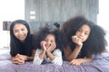 Happy family love bonding, enjoy spending time together at home, Portrait of African Asin mixed race daughter girls with curly