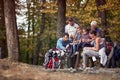 A happy family in love with their dog enjoying the forest together Royalty Free Stock Photo