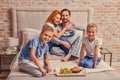 Happy family lying down on bed at home Royalty Free Stock Photo