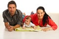 Happy family lying down on floor Royalty Free Stock Photo