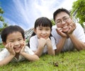 Happy family lying on the grass Royalty Free Stock Photo