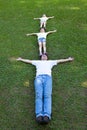 Happy family lying on the grass Royalty Free Stock Photo