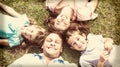 Happy family lying on the grass in a circle Royalty Free Stock Photo