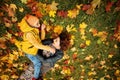 Happy Family Lying on Grass Outdoors. Parental Care