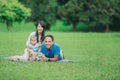 Happy family lying in the grass Royalty Free Stock Photo