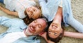 Happy family in lying on rug in living room