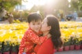 Happy family making photo in Tet flower market Royalty Free Stock Photo