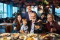 Happy family making portrait during Christmas celebration in restaurant Royalty Free Stock Photo