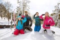 Family making snow balls on skiing in mountain Royalty Free Stock Photo