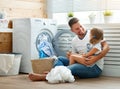 Happy family man father householder and child in laundry with Royalty Free Stock Photo