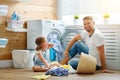 Happy family man father householder and child in laundry with Royalty Free Stock Photo