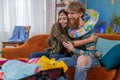 Happy family man woman tourist packing suitcase luggage preparation for vacation trip journey at sea Royalty Free Stock Photo