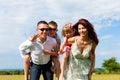 Happy family on a meadow in summer Royalty Free Stock Photo