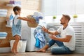 Happy family man father householder and child in laundry with Royalty Free Stock Photo