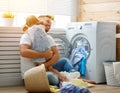 Happy family man father householder and child in laundry with Royalty Free Stock Photo