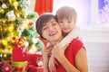 Happy family and Merry Christmas. Mother and baby son at Christmas morning Royalty Free Stock Photo