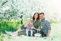 Happy family mom dad and baby daughter having fun outdoor in park smiling and laughing. Lifestyle Emotions Relationship Love