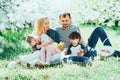 Happy family mom dad and kids daughter and son having fun outdoor in park smiling and laughing. Lifestyle Emotions Relationship