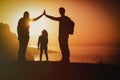 Happy family-mom, dad and little daughter-enjoy travel at sunset Royalty Free Stock Photo